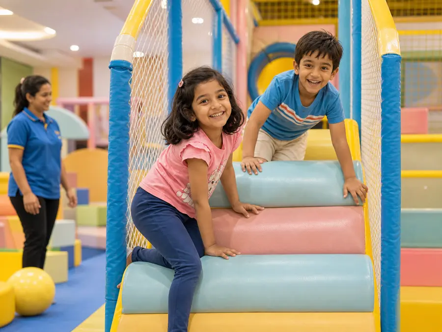 Indian children playing together in a colorful indoor play area